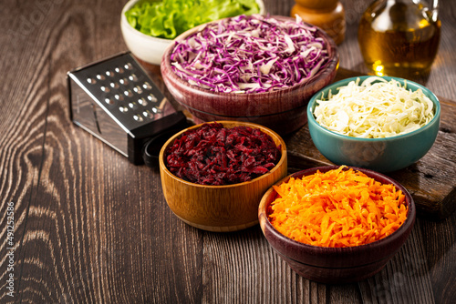 Fresh grated vegetables in bowls on the table. Healthy food.