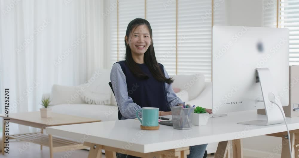 Asia people young casual woman sit smile work at table desk home workspace self learn on laptop in modern workforce reskill career upskill job data analyst MBA lesson. Happy face girl look at camera. Asia people young casual woman sit smile work at table desk home workspace self learn on laptop in modern workforce reskill career upskill job data analyst MBA lesson. Happy face girl look at camera.
