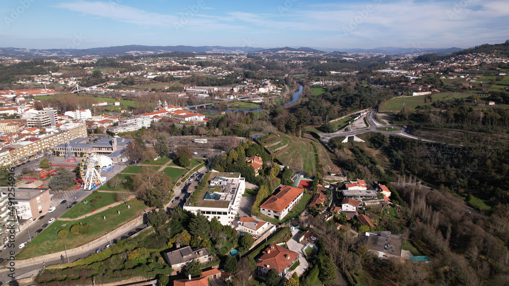 Santo Tirso, Portugal - January 1, 2022: DRONE AERIAL VIEW- Apartment buildings, 25th of April Square (Portuguese: Praca 25 de Abril) and Santo Tirso City Hall.