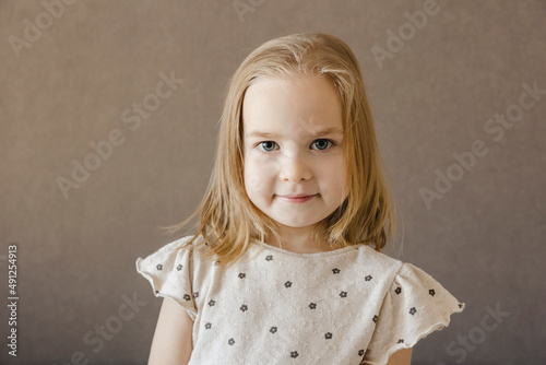 Cute blond girl at home photo