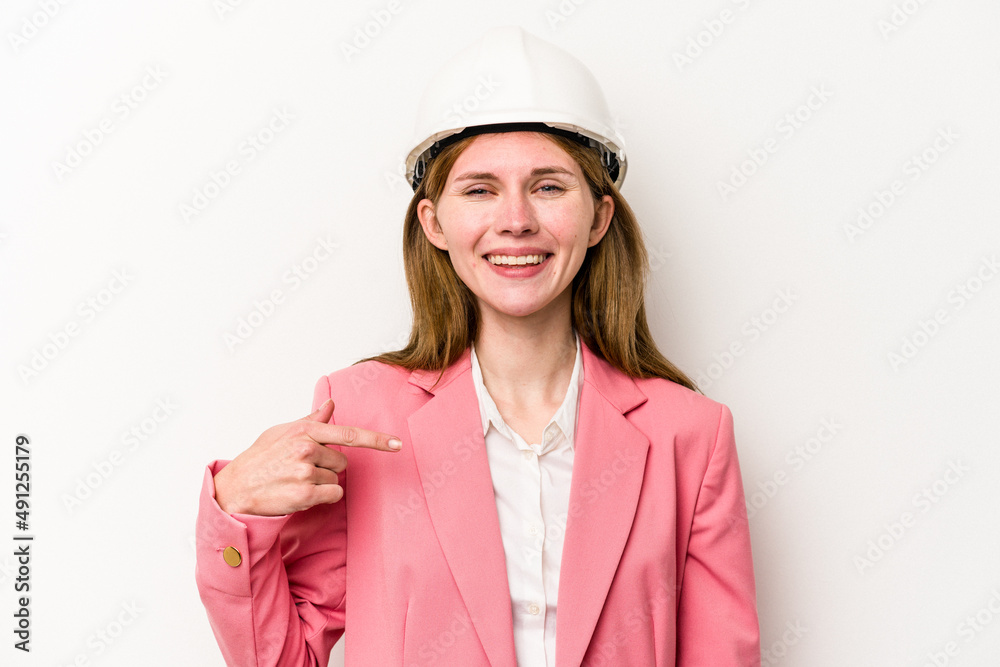 Young architect English woman with helmet isolated on white background person pointing by hand to a shirt copy space, proud and confident Young architect English woman with helmet isolated on white background person pointing by hand to a shirt copy space, proud and confident