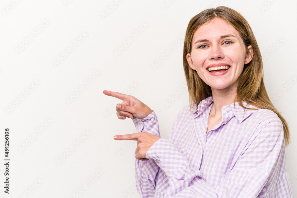 Young russian woman isolated on white background excited pointing with forefingers away. Young russian woman isolated on white background excited pointing with forefingers away.