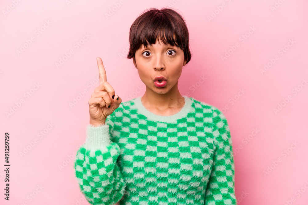Young hispanic woman isolated on pink background having some great idea, concept of creativity. Young hispanic woman isolated on pink background having some great idea, concept of creativity.