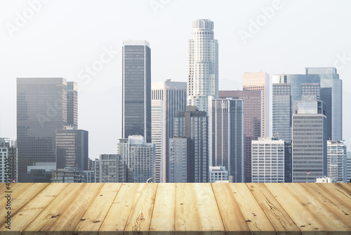 Table top made of wooden dies with beautiful Los Angeles skyline on background  mockup