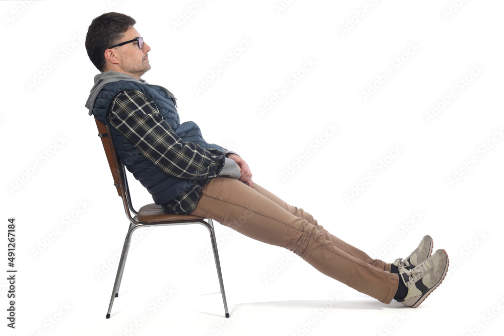 man relaxed on a chair on white background
