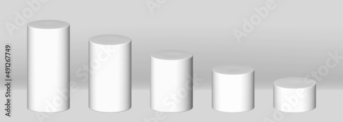 White 3d cylinder collection with perspective, isolated on grey background.