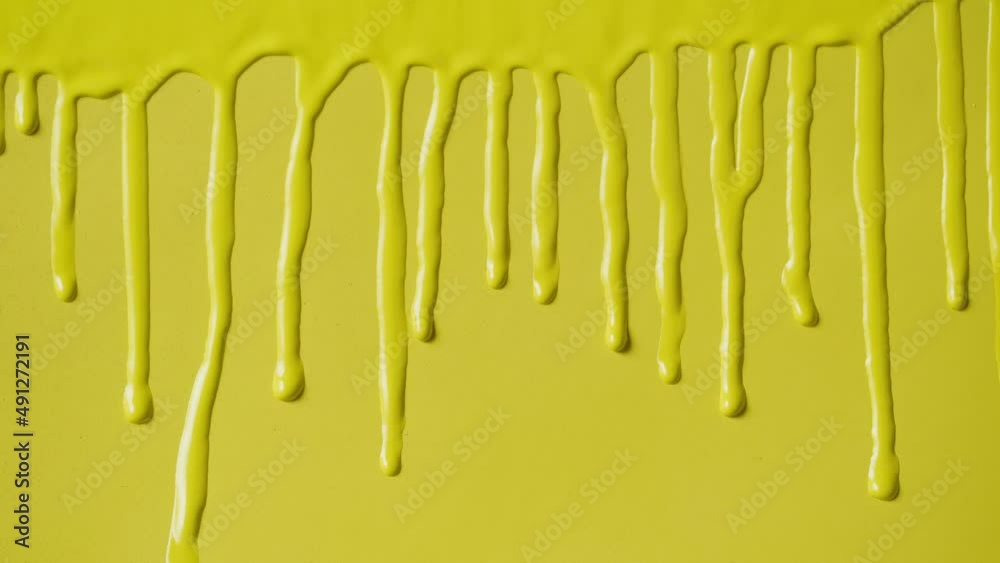 Yellow paint background, color tint drops on wall close-up. Renovation concept. Watercolor or acrylic texture. Home interior improvement, overhaul. Yellow paint background, color tint drops on wall close-up. Renovation concept. Watercolor or acrylic texture. Home interior improvement, overhaul.