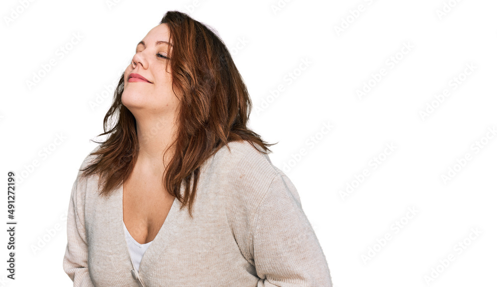 Young plus size woman wearing casual clothes with hand on stomach because nausea, painful disease feeling unwell. ache concept. Young plus size woman wearing casual clothes with hand on stomach because nausea, painful disease feeling unwell. ache concept.
