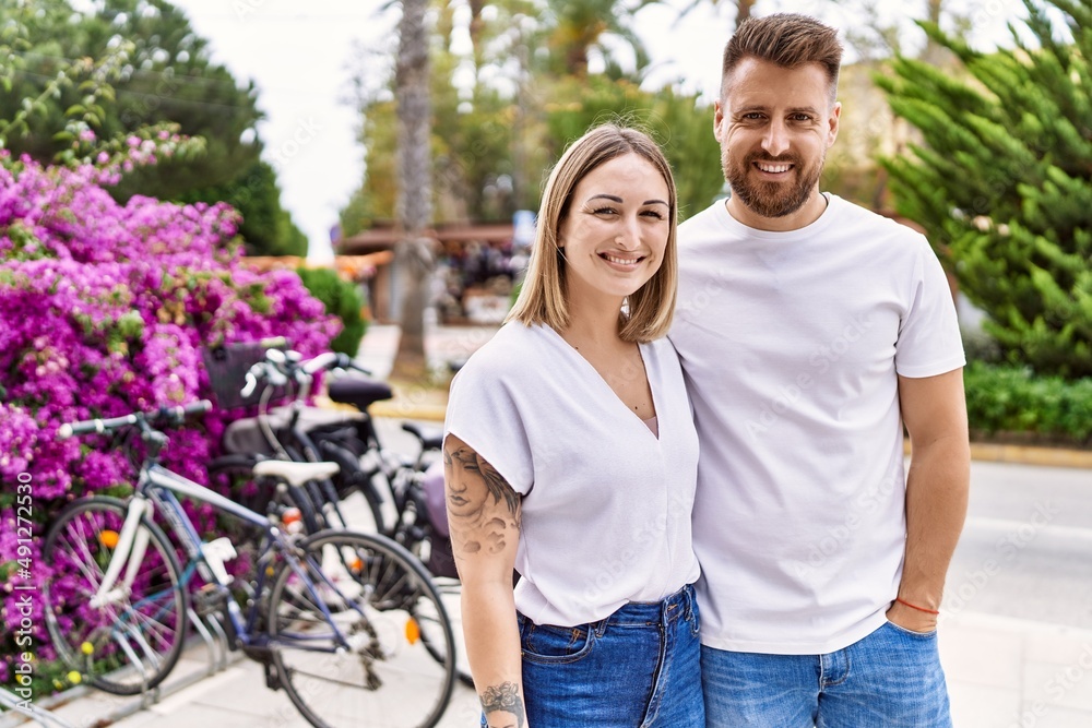 Young caucasian couple of boyfriend and girlfriend having fun outdoors on a un sunny day Young caucasian couple of boyfriend and girlfriend having fun outdoors on a un sunny day