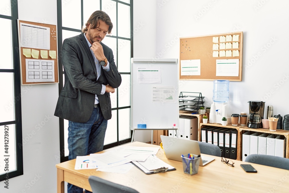 Middle age caucasian man smiling confident working at office