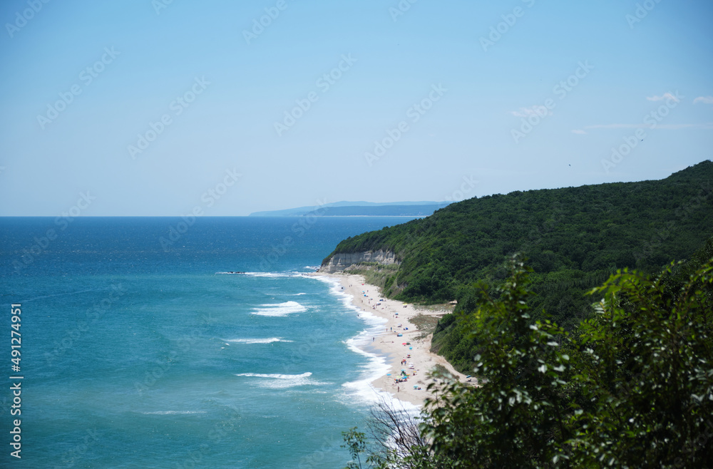 Tropical beach and sea near the green mountain. Travel or vacation concept.
