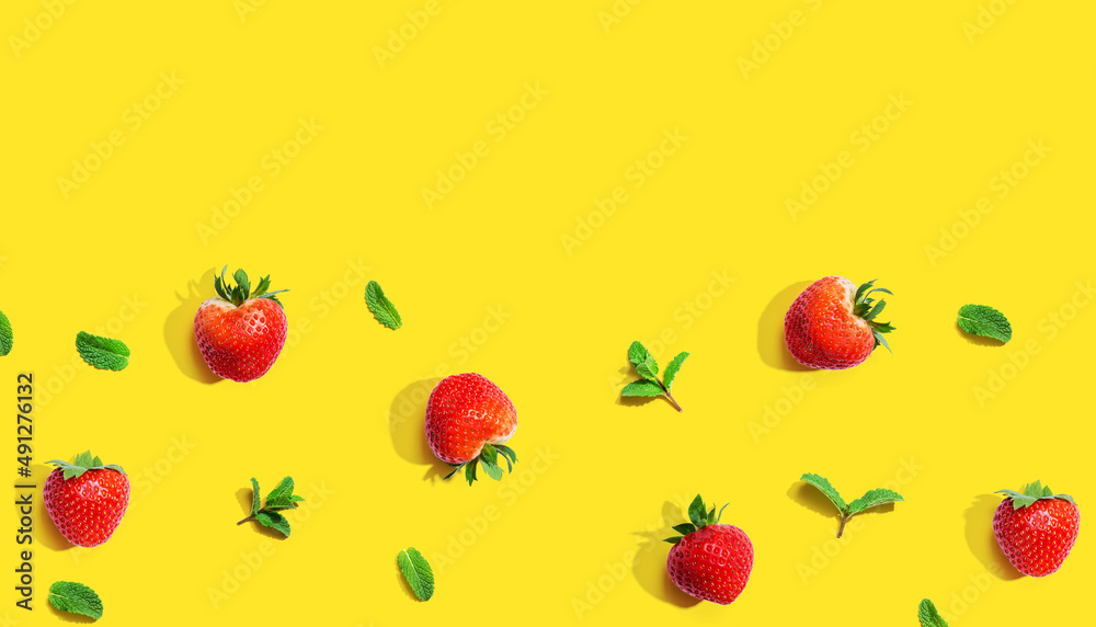 Fresh red strawberries with mints overhead view - flat lay Fresh red strawberries with mints overhead view - flat lay
