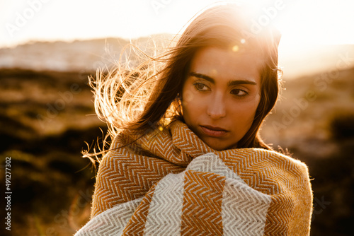 Beautiful woman wrapped in a wool towel