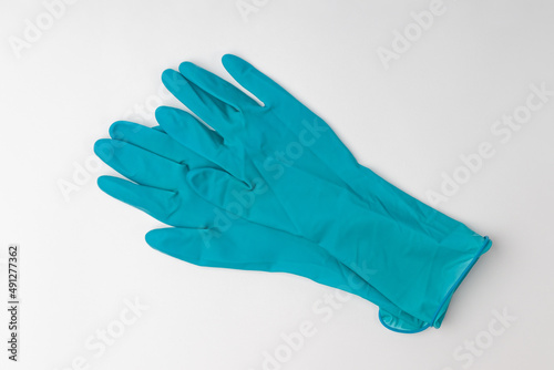 a pair of blue medical gloves on a white background