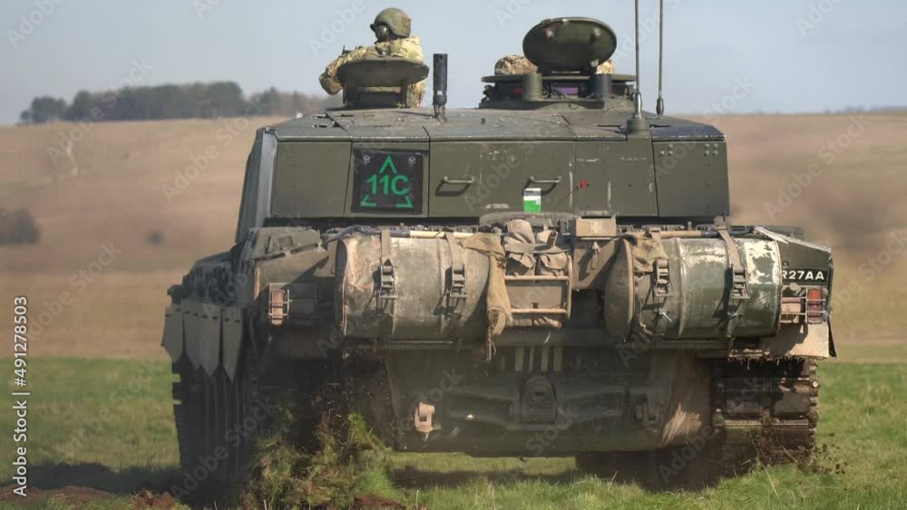 British army FV4034 Challenger 2 main battle tank with the commander and gunner directing action on a military exercise, Wiltshire UK