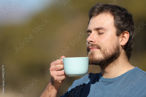 Man enjoying coffee cup in nature