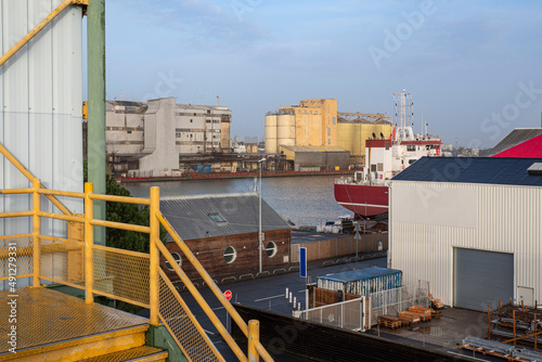 Grain silo and industrial building on the quay of a harbour in Saint Nazaire  France  with boats