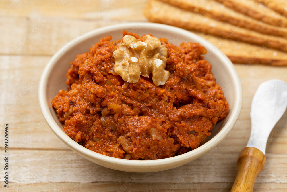 Bowl with fresh made muhammara close up as appetizer 