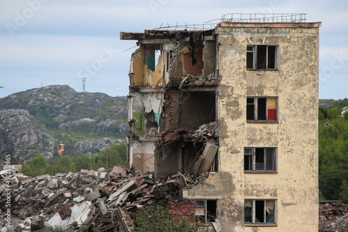 Russia  Gadzhievo - August 14  2021  demolition of residential buildings with construction equipment