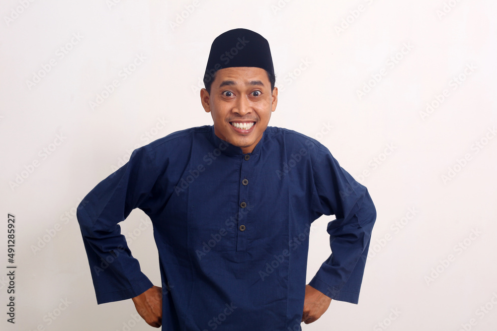 Funny expression of asian muslim man. Isolated on white background Funny expression of asian muslim man. Isolated on white background