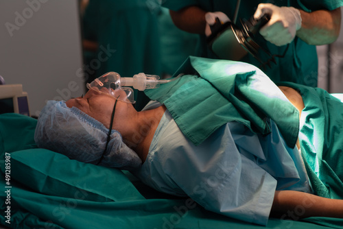 Fotografie Hands of doctor holding defibrillator electrodes, performing defibrillation or e