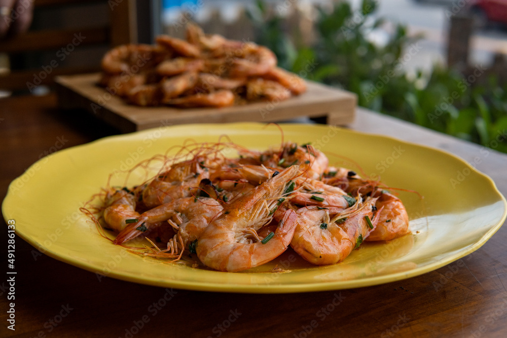 shrimp - tasty fried pink prawns served on a plate shrimp - tasty fried pink prawns served on a plate