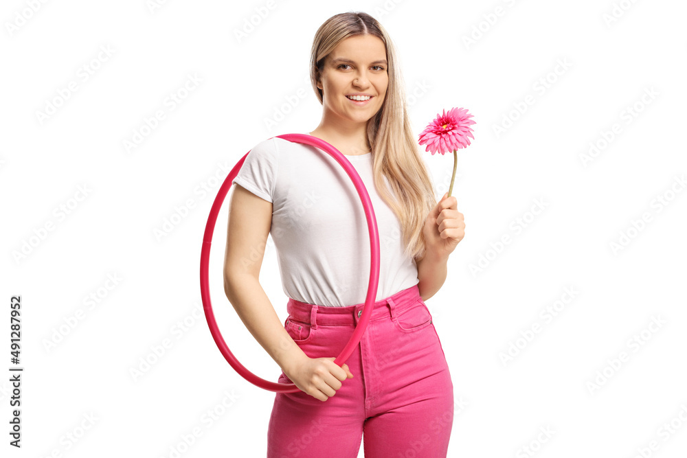 Young casual female holding a pink flower and a hula hoop Young casual female holding a pink flower and a hula hoop