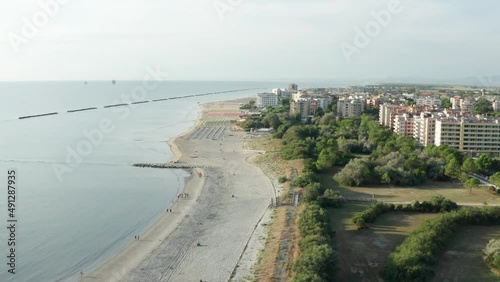Wallpaper Mural Aerial shot of sandy beach with umbrellas and adriatic sea, typical Emilia Romagna shore.Summer vacation concept.Lido Adriano town,Adriatic coast, Emilia Romagna,Italy. Torontodigital.ca