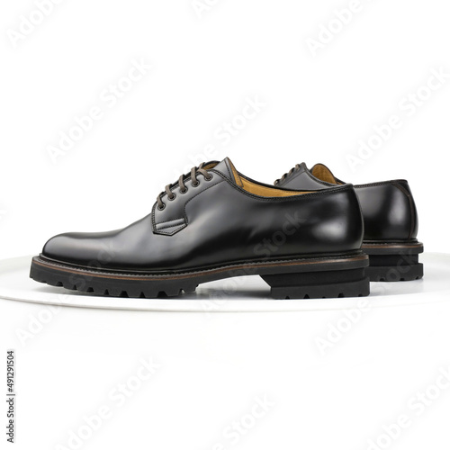 Brown leather derby shoes on a white background