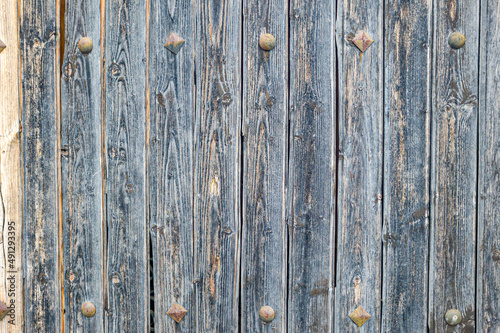 Beautiful background - old gray boards with rusty nails