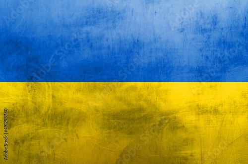 Vintage image of the national flag of Ukraine on a metal surface.