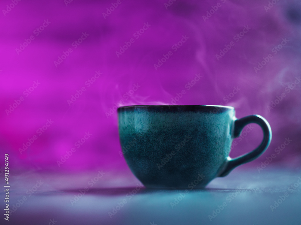 Fototapeta premium Coffee cup smoke, purple dark background copy space