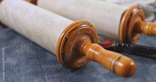 Jewish religious symbols with shofar tallit prayer book of torah scrolls a pointer in synagogue