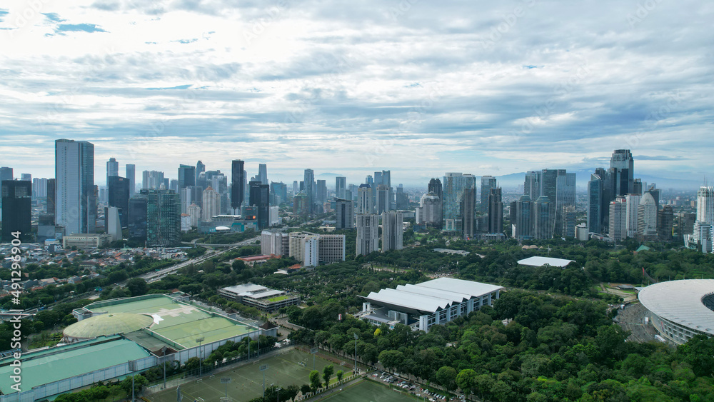Aerial view of the Beautiful scenery of Senayan Stadium. with Jakarta cityscape background. Jakarta, Indonesia, March 8, 2022