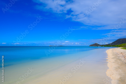 Ocean shore, in the north of the Dominican Republic, mountains in background. © ALEKSEI