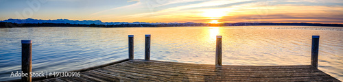 old wooden jetty at a lake photo