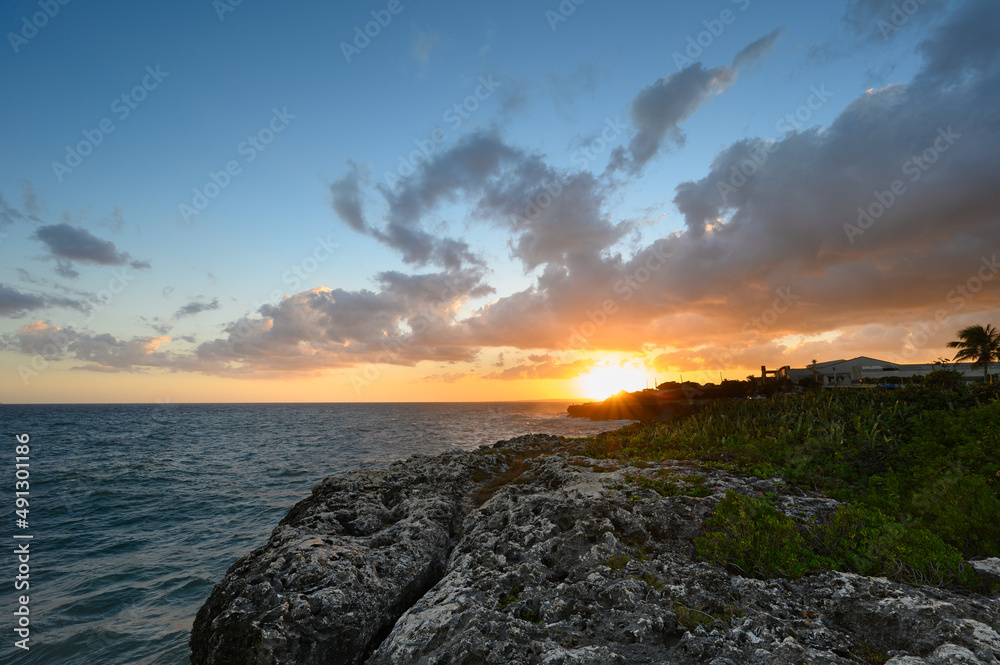 Rocky seashore at sunset in Santo Domingo. Caribbean tourist destination.