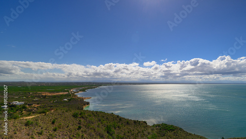 View from the mountain to bay in ocean. Beautiful blue sky with clouds. © ALEKSEI