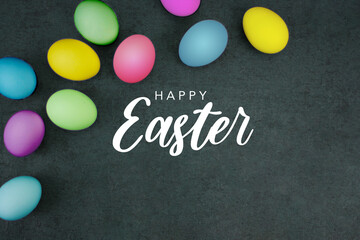 Happy Easter Text Card Design with Colored Easter Eggs Border Over Black Paper Background Texture