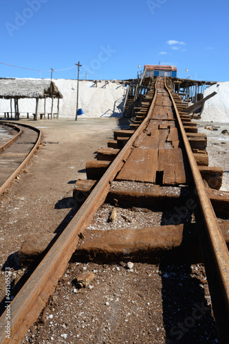 Vintage railway. Old rails at a salt factory. Sea salt. Blue sky. The photo.