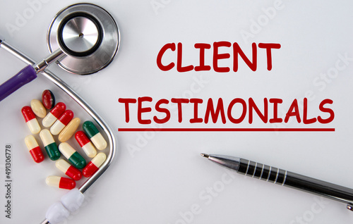 CLIENT TESTIMONIALS - words on a light background with tablets and stethoscope