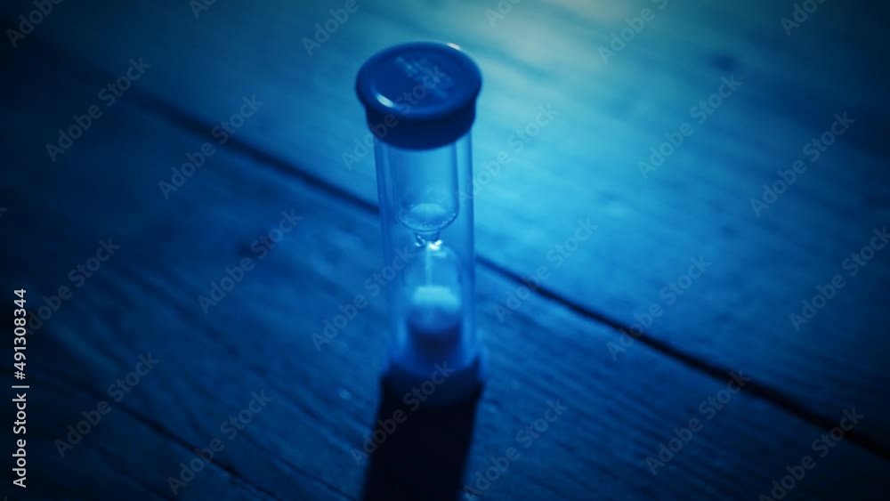 Close up of egg timer running out of sand