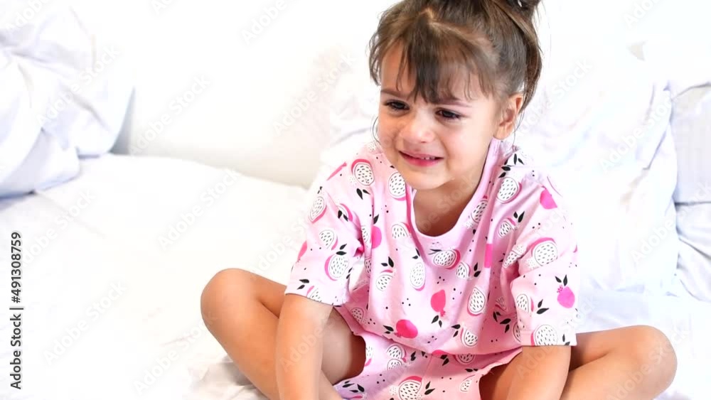 Video portrait of little toddler girl crying with mouth wide open and tears down her face. Isolated on white background. Childhood concept. Video portrait of little toddler girl crying with mouth wide open and tears down her face. Isolated on white background. Childhood concept.