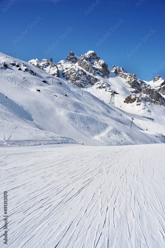 Ski slope on snowy mountain 