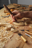 Woodworker. Man working with woodcarving instruments
