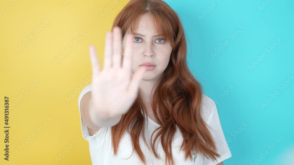 A beautiful red-haired Ukrainian woman says stop no more war