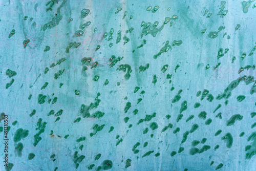 Fototapeta Naklejka Na Ścianę i Meble -  Turquoise blue aged weathered metal surface door with green rain water drops background texture