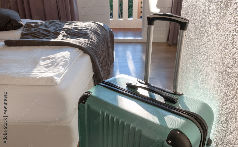 suitcase luggage baggage room hotel window balcony bed sun sunshine