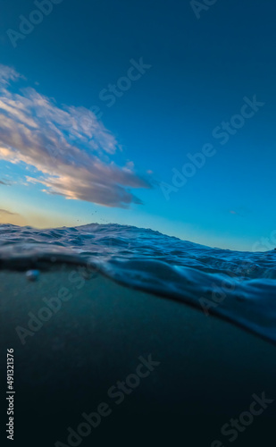 Under Over OCean waters with blue sky