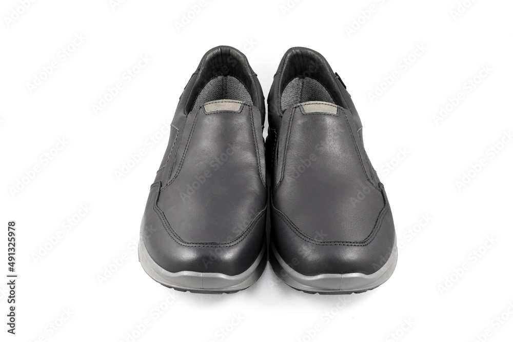 Black leather shoes isolated on white background. Full depth of field. Close-up. Black leather shoes isolated on white background. Full depth of field. Close-up.